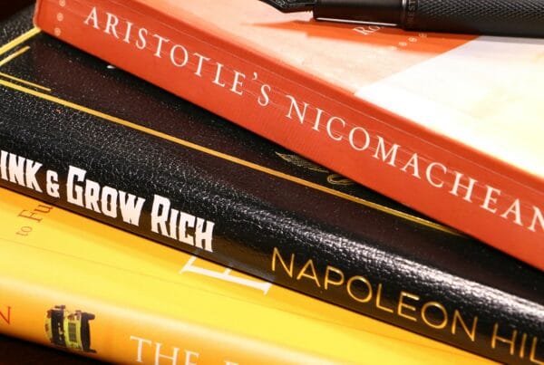 Notebook and pen on books for IBDP Math past papers article