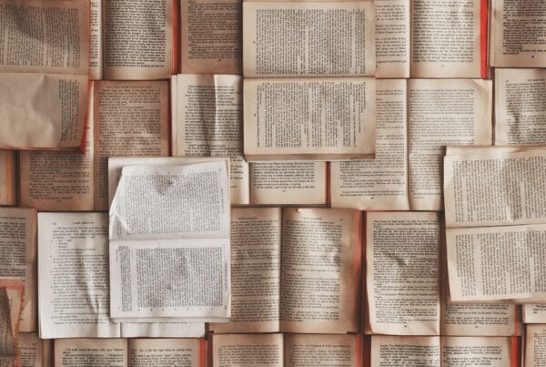 academic books arranged on a study shelf